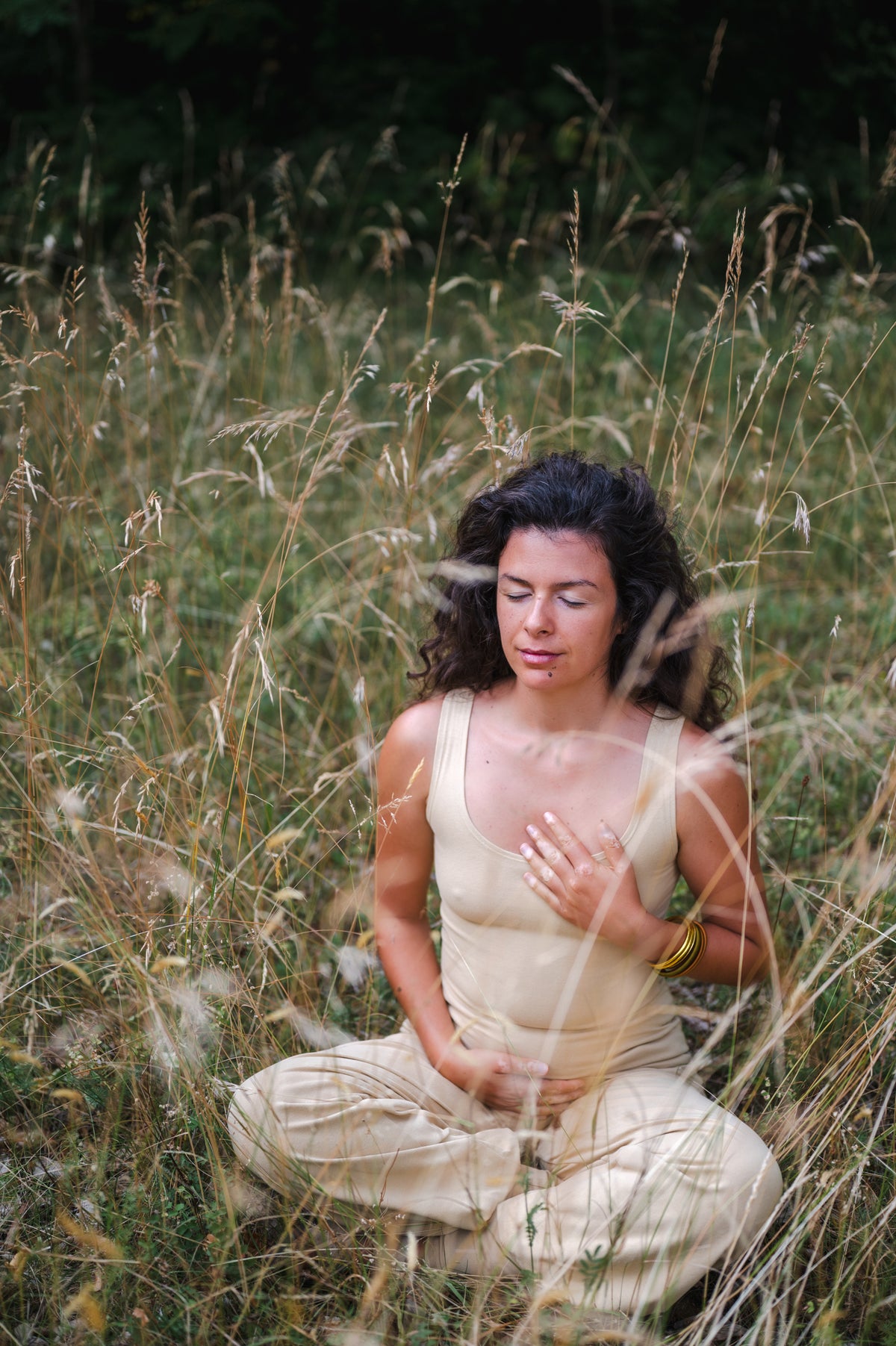 Woman practicing yoga in Breath of Fire organic cotton wear, Swiss family brand handcrafted in Portugal
