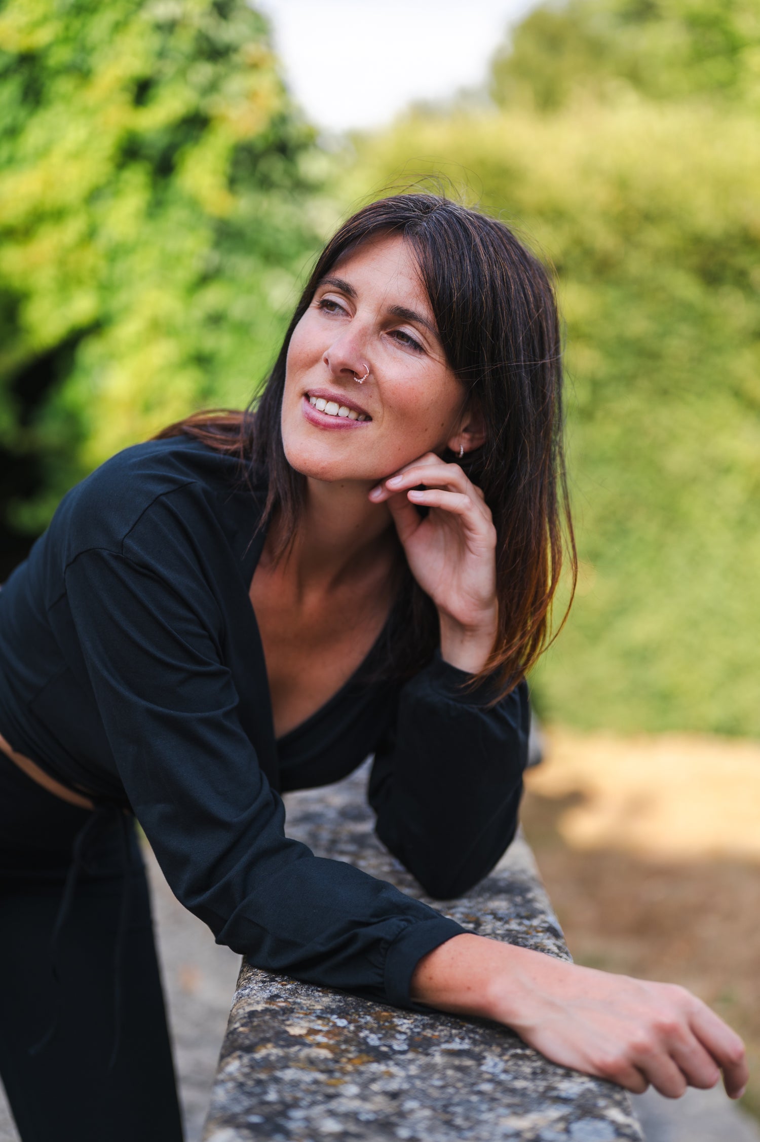 Breath of Fire Talya wrap shirt — Black — lifestyle photo, organic cotton wrap worn during yoga practice