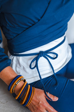 Breath of Fire Talya wrap shirt — Navy — lifestyle photo, wrap top detail, ethical fashion