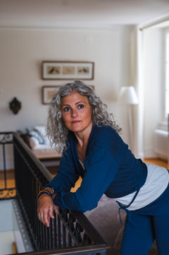 Breath of Fire Talya wrap shirt — Navy — movement shot mercerized organic cotton ethical yoga clothing